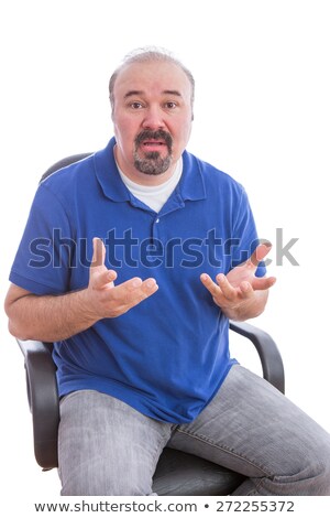 Stock photo: Bearded Adult Guy On A Chair Questioning Something