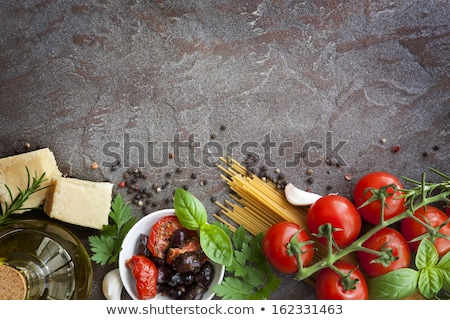 Foto stock: Italian Food Background With Vine Tomatoes Basil Spaghetti Olives Parmesan Olive Oil Garlic