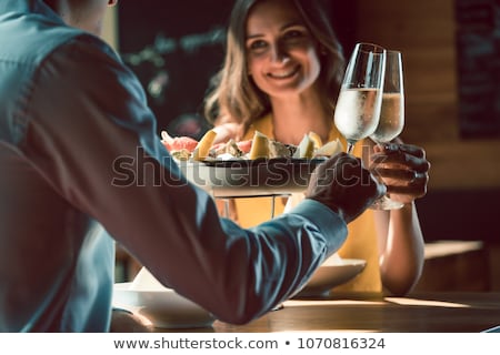 夫婦敬酒香檳和微笑 商業照片 © Kzenon