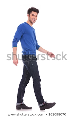 Сток-фото: Side View Of A Laughing Casual Man Walking