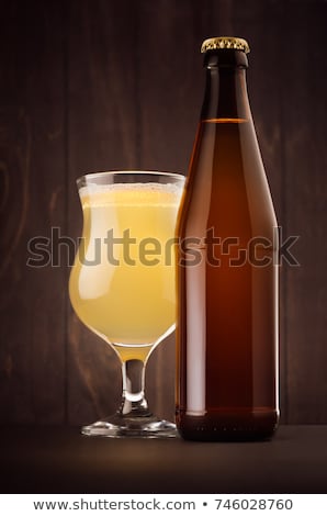 Stockfoto: Beer Glass With Muddy Weizen On Dark Wood Board Vertical