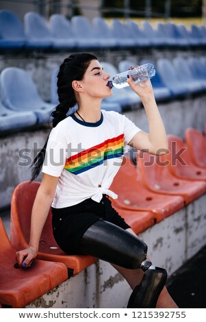 Foto d'archivio: Image Of Sporty Disabled Invalid Sportswoman In Tracksuit Wearin