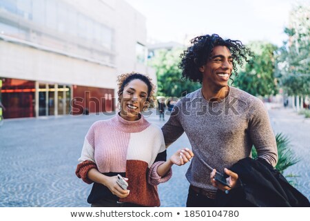 Foto stock: Excited Young Multiethnic Couple Spending Time Together