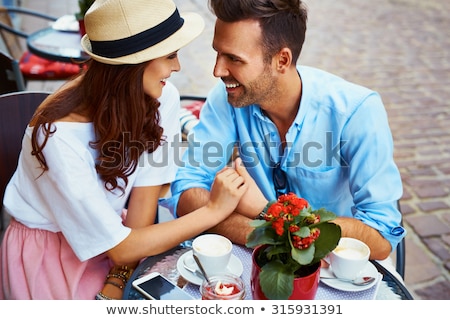 Stockfoto: Loving Couple Sitting In Cafe