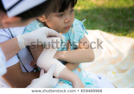 Stok fotoğraf: Girl Elbow With An Adhesive Bandage