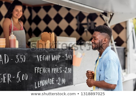 Stock foto: Male Customer Looking At Billboard At Food Truck