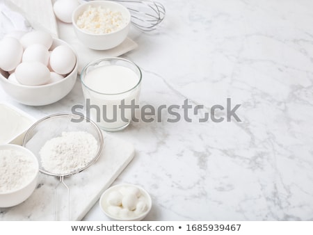 Foto stock: Fresh Dairy Products On White Table Background Glass Of Milk Bowl Of Flour Sour Cream And Cottage