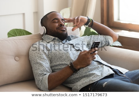 Stockfoto: Man Listening To Tunes