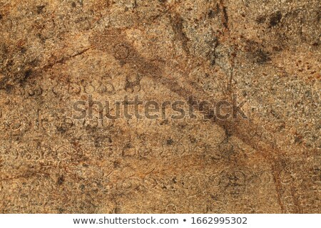 [[stock_photo]]: Medieval Inscriptions On Stone Wall Sri Lanka