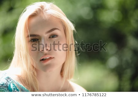 Stockfoto: Woman Biting Her Lip On White Background