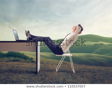 Zdjęcia stock: Young Business Man Sleeps At Office With Feet On Desk