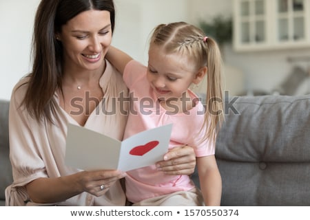 Сток-фото: Happy Female Enjoying Greeting Card