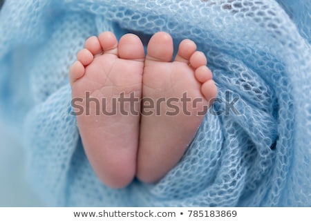 Stock photo: Babies Feet Lying On Blanket