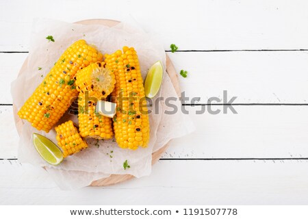 [[stock_photo]]: Grilled Corn On The Cob With Butter On A White Plate