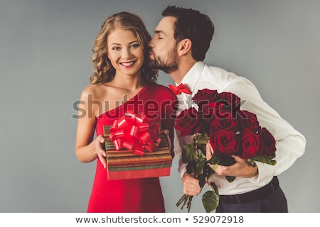 Сток-фото: Elegant Young Woman Holding Her Bow Tie