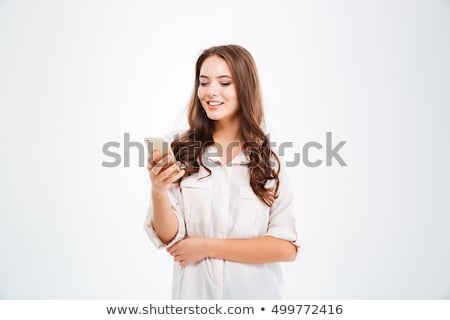 Stock photo: Cheerful Young Woman Using Mobile Phone