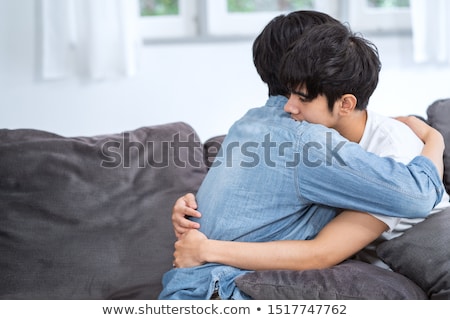 ストックフォト: Young Gay Men Sleeping And Relaxing On Sofa At Home