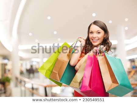 ストックフォト: Woman With Shopping Bags Over Mall Background