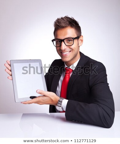 Stockfoto: Business Man With Tablet Pad At His Desk
