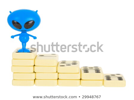 Blue Toy Alien On A Heap From Dominoes Stockfoto © pzAxe