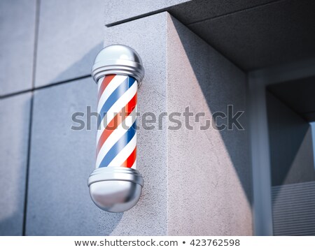 Zdjęcia stock: Classic Barber Shop Pole On The Gray Wall 3d Rendering