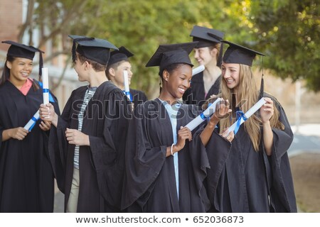 Stock fotó: Smiling Graduate School Kids Standing With Degree Scroll In Campus At School