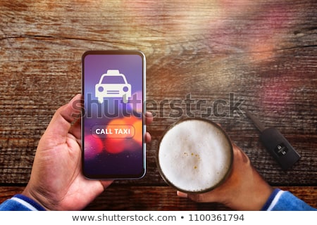 Foto stock: Man With Smartphone And Beer Calling At Bar Or Pub