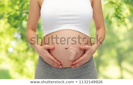 ストックフォト: Close Up Of Pregnant Woman Over Natural Background