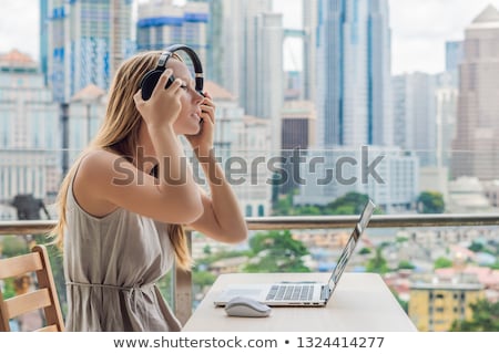 Stock fotó: Young Woman Teaches A Foreign Language Or Learns A Foreign Language On The Internet On Her Balcony A