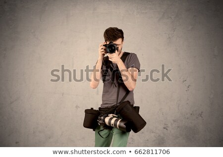 Foto stock: Hand Photo Shooting An Empty Grey Wall