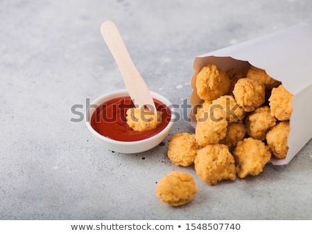 Stok fotoğraf: Crunchy Southern Chicken Popcorn Bites In White Paper Container For Fast Food Meals With Ketchup And