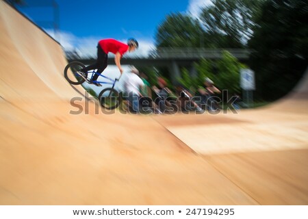 Foto stock: Bmx Biker Performing Tricks During Ride On A Ramp