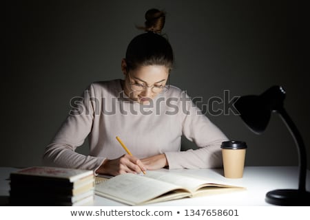 Stock fotó: Young Female Student Preparing For Exams Late At Home