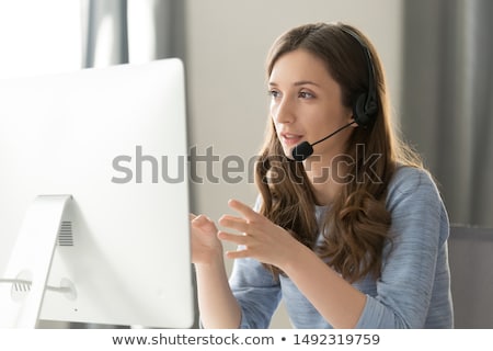 Foto stock: Female Customer Support Executive Assisting