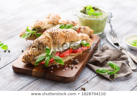 ストックフォト: Chicken Salad With Tomatoes In The Background On Wood Table