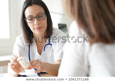 [[stock_photo]]: Doctor Prescribing Medication