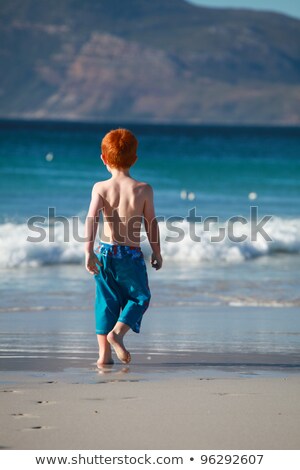 Stock photo: Boy With Red Hair Is Enjoying The Ocean