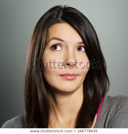 Foto stock: Young Long Haired Brunette With Wry Face