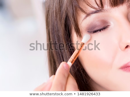 Stock fotó: Man Doing Make Up For Cute Woman In Beauty Salon