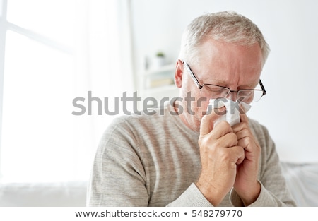 ストックフォト: Sick Senior Man With Paper Wipe Blowing His Nose