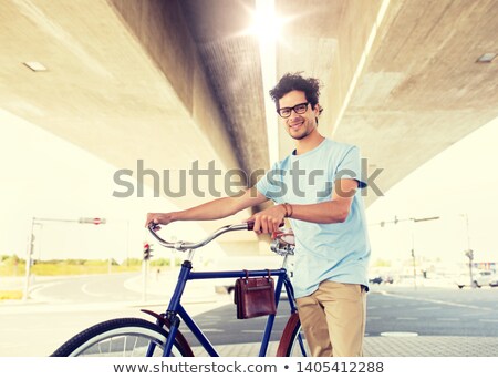 Stockfoto: Hipster Man With Fixed Gear Bike Under Bridge