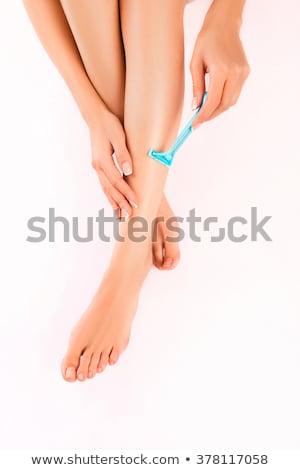 Stock fotó: Woman Shaving Her Legs