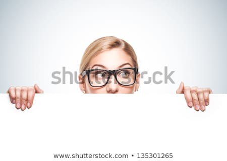 Woman Looking Over White Board Isolated On White Background Foto d'archivio © doodko