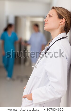 Zdjęcia stock: Thoughtful Doctor Against A Wall In A Hallway