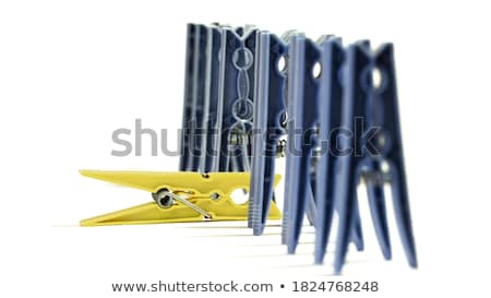 Foto stock: Clothes Pin Standing Out From The Crowd