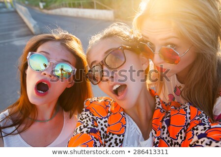 Stock photo: Happy Joyful Man With Sunglasses Looking At Summer Icons