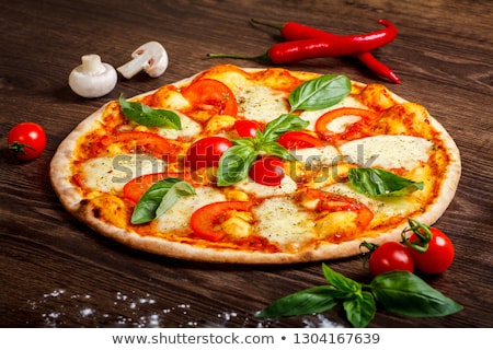 Stockfoto: Sliced Prosciutto And Mozzarella With Basil And Tomatoes