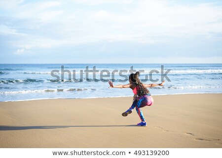 Stock fotó: Back View Of Woman Practicing Balance Yoga Exercise Towards The Sea During Fitness Outdoor Workout A