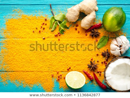 商業照片: Traditional Curry And Ingredients On Blue Background