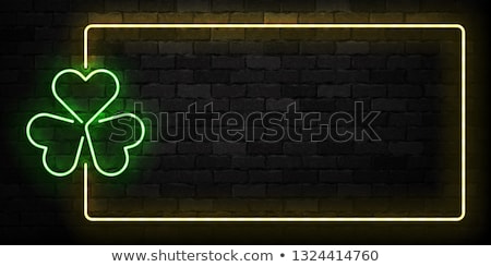 Stok fotoğraf: St Patricks Day Neon Sign And Green Brick Wall Realistic Sign